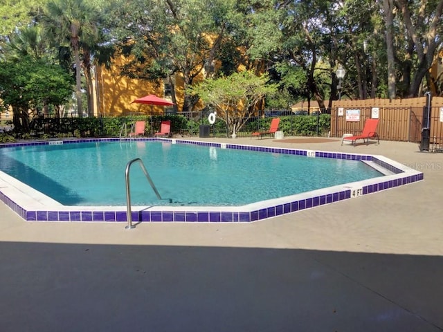 view of swimming pool featuring a patio