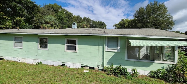 view of side of home featuring a lawn