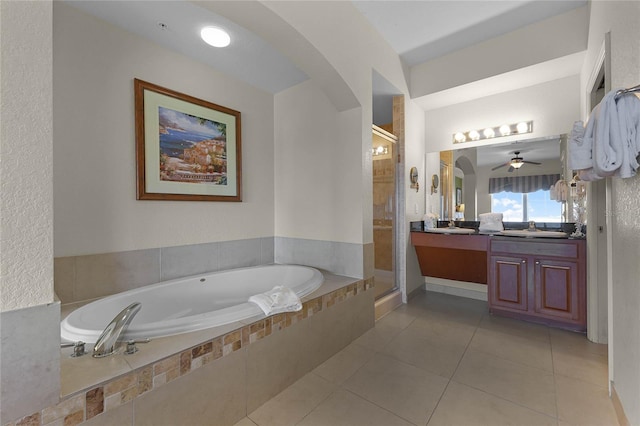 bathroom featuring ceiling fan, vanity, shower with separate bathtub, and tile patterned flooring