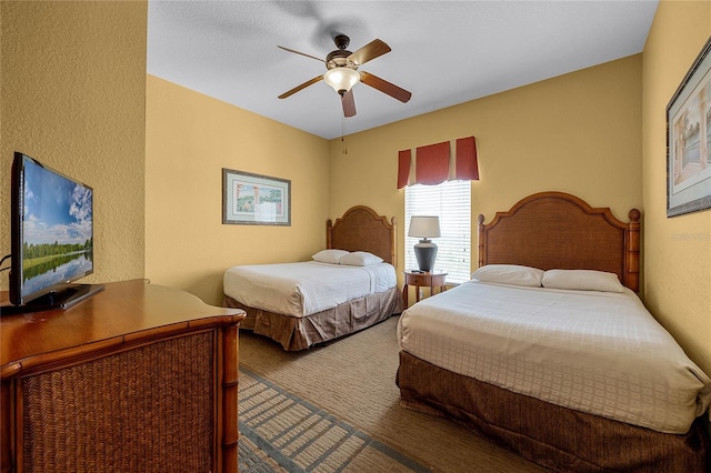 bedroom featuring ceiling fan and carpet floors