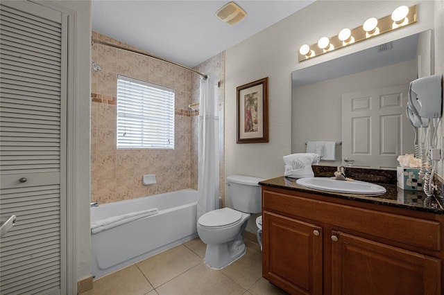 full bathroom featuring vaulted ceiling, vanity, tile patterned flooring, shower / tub combo with curtain, and toilet