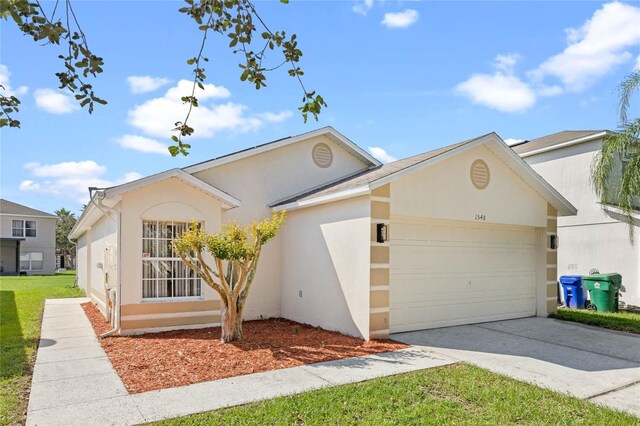 1548 Tiverton Blvd, Winter Garden, FL 34787 - ranch-style house with a garage, stucco siding, and driveway