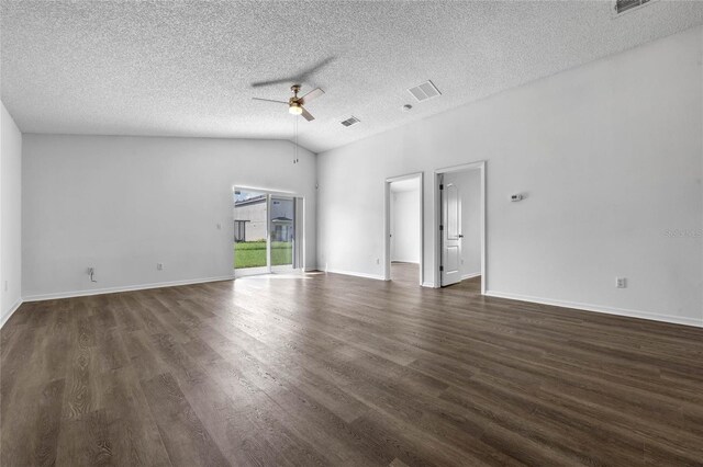 unfurnished room with ceiling fan, a textured ceiling, lofted ceiling, and dark hardwood / wood-style floors