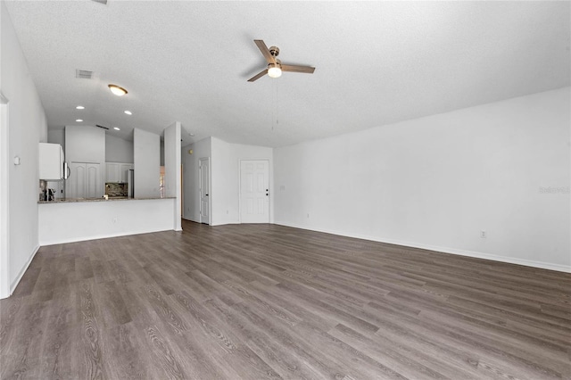 1548 Tiverton Blvd, Winter Garden, FL 34787 - unfurnished living room with recessed lighting, dark wood-style floors, visible vents, lofted ceiling, and ceiling fan
