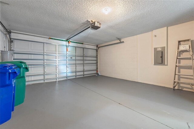 garage featuring electric panel and a garage door opener