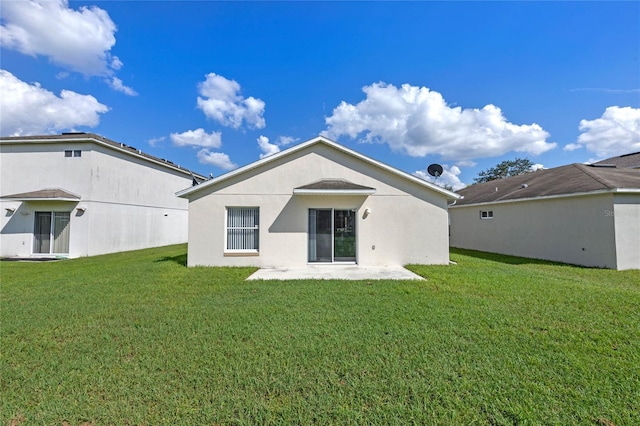 1548 Tiverton Blvd, Winter Garden, FL 34787 - back of house featuring a patio area, a lawn, and stucco siding