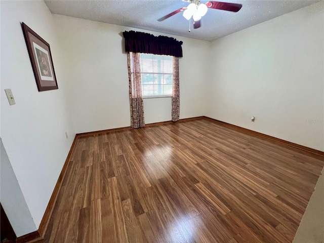 unfurnished room with hardwood / wood-style flooring, a textured ceiling, and ceiling fan