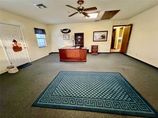 interior space with ceiling fan