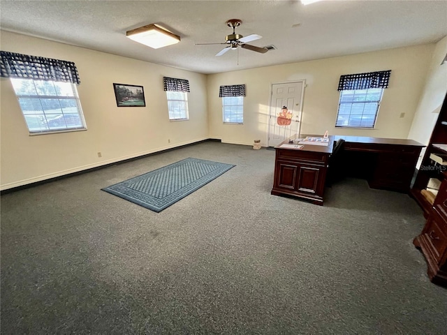 office area with ceiling fan and a textured ceiling