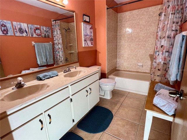 full bathroom with vanity, toilet, tile patterned floors, and shower / bath combo with shower curtain