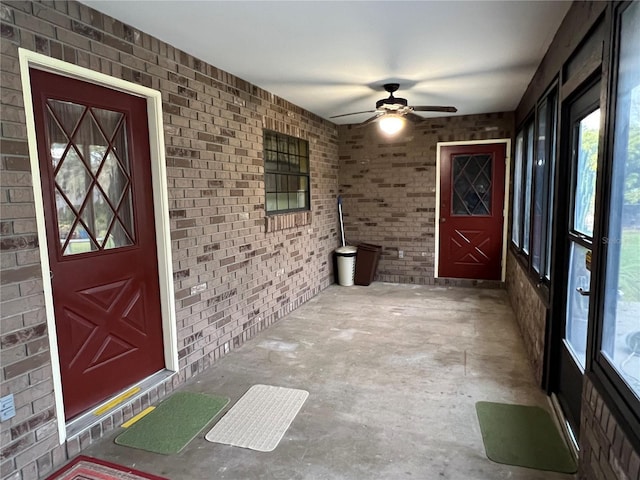 property entrance featuring ceiling fan