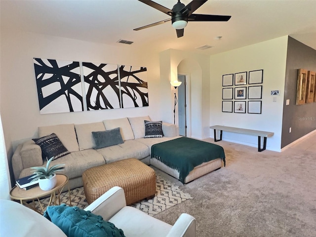 living room with ceiling fan and carpet floors