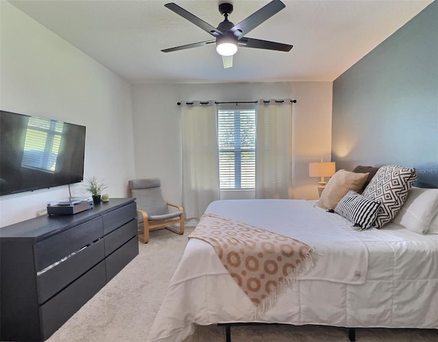 bedroom featuring ceiling fan and light colored carpet