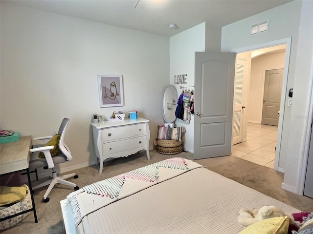 bedroom with light colored carpet