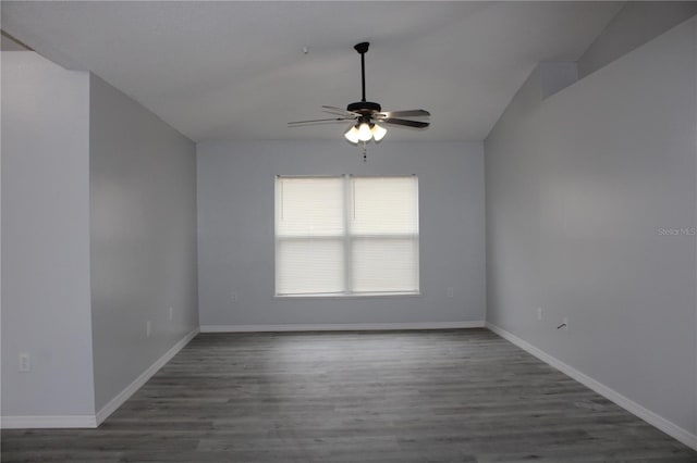 empty room with ceiling fan and dark wood-type flooring