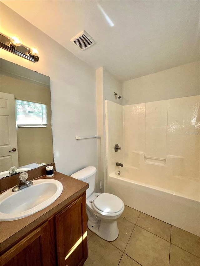 full bathroom featuring vanity, bathtub / shower combination, toilet, and tile patterned flooring