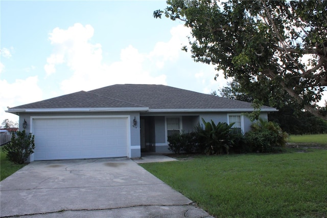 single story home featuring a garage and a front lawn