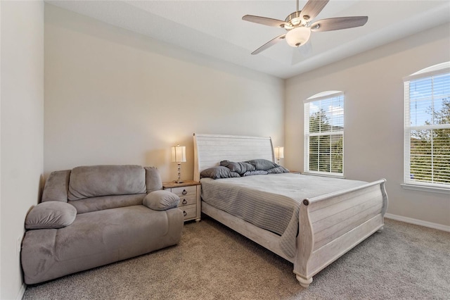 bedroom with ceiling fan and light carpet