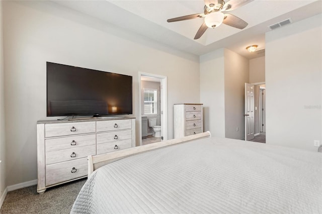 bedroom featuring ceiling fan, ensuite bathroom, and carpet flooring