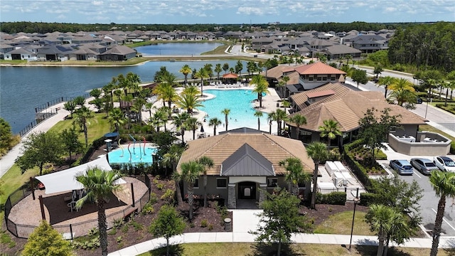 birds eye view of property with a water view