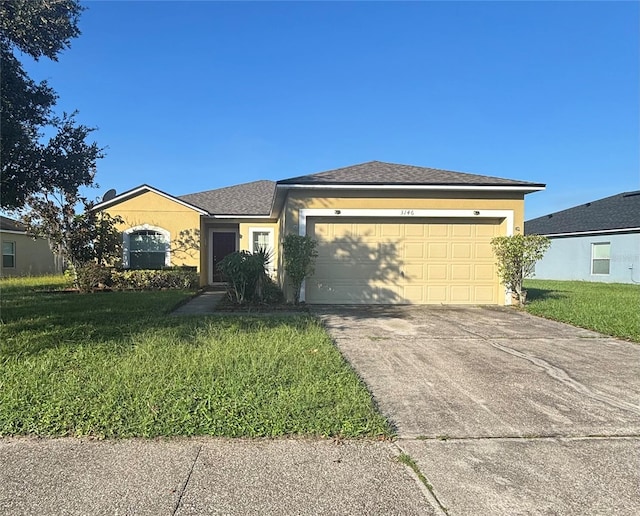 view of front facade featuring a garage and a front lawn