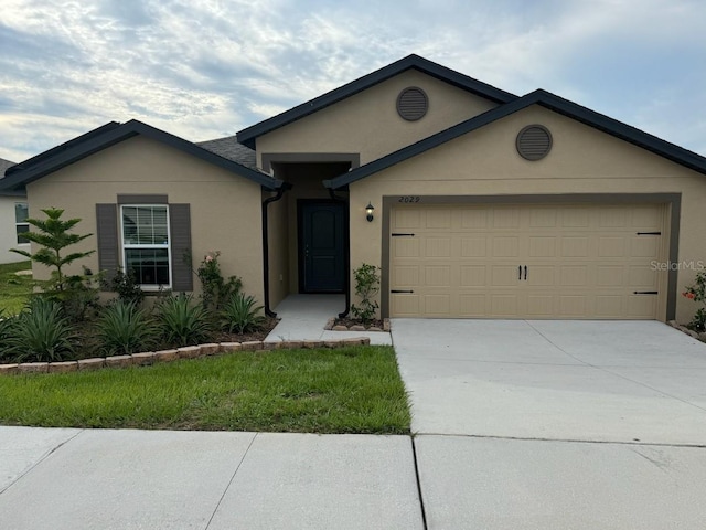 ranch-style home with a garage