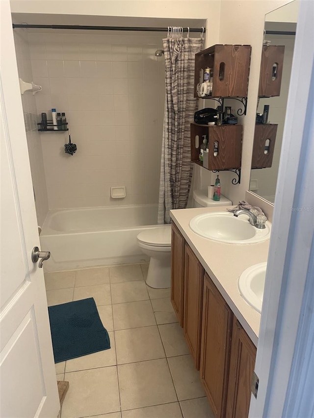 full bathroom with toilet, vanity, shower / bath combination with curtain, and tile patterned flooring