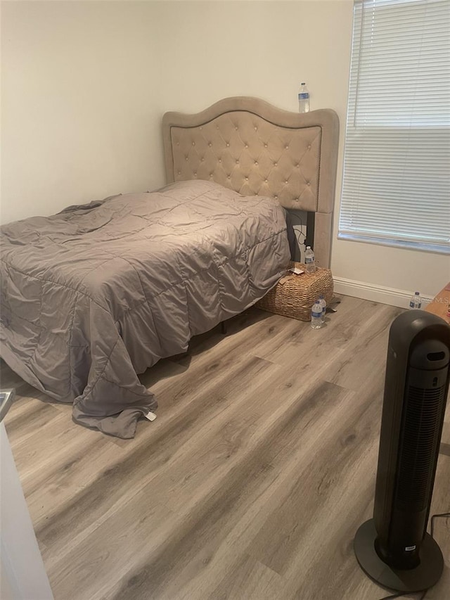 bedroom featuring hardwood / wood-style floors