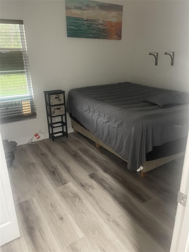 bedroom featuring hardwood / wood-style floors