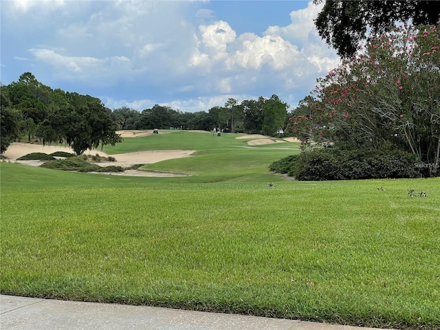 surrounding community featuring a lawn