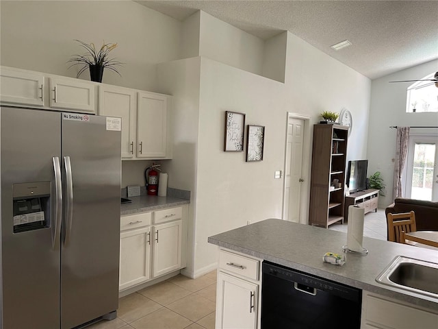 kitchen featuring black dishwasher, light tile patterned floors, a textured ceiling, white cabinets, and stainless steel fridge with ice dispenser