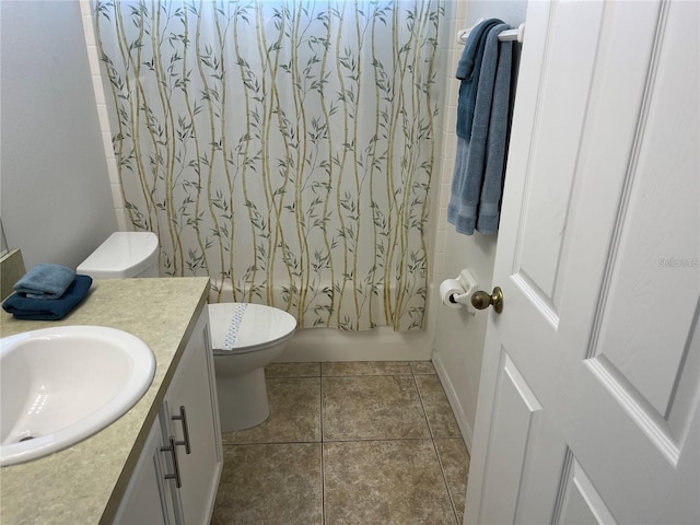 full bathroom featuring toilet, vanity, shower / bathtub combination with curtain, and tile patterned flooring