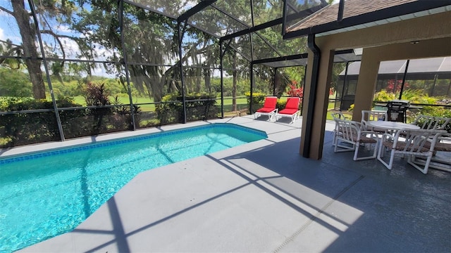 view of pool featuring a patio area and a lanai