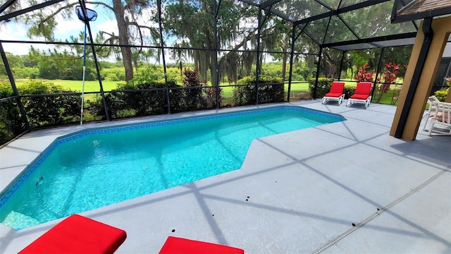 view of swimming pool with a patio and glass enclosure