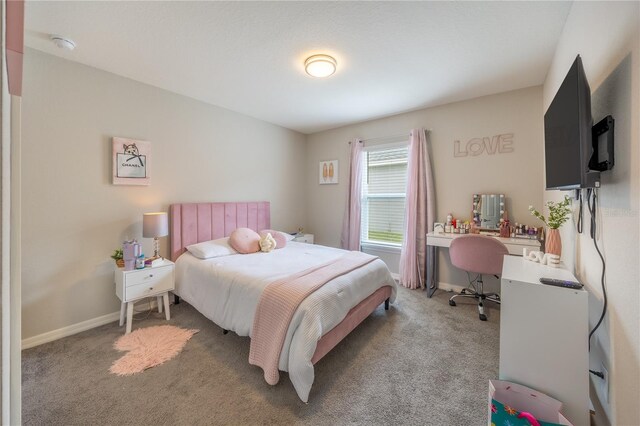 872 Sydney St, Davenport, FL 33837 - bedroom featuring light carpet, a desk, and baseboards