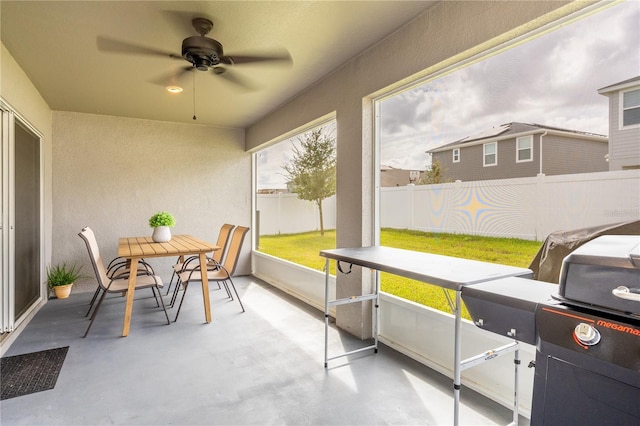 sunroom / solarium with ceiling fan