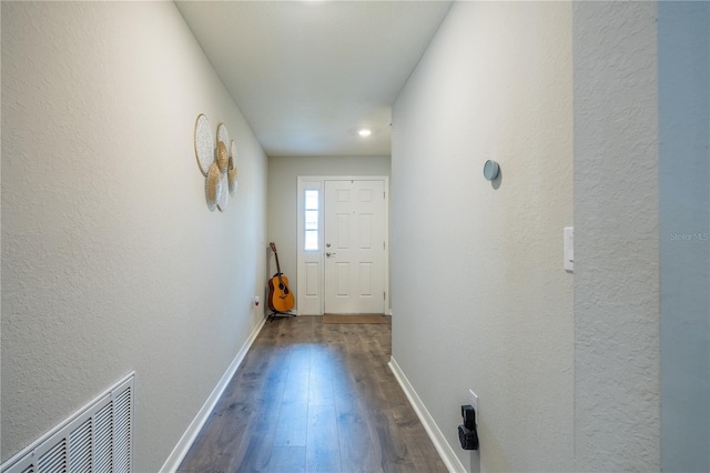 doorway featuring dark hardwood / wood-style floors