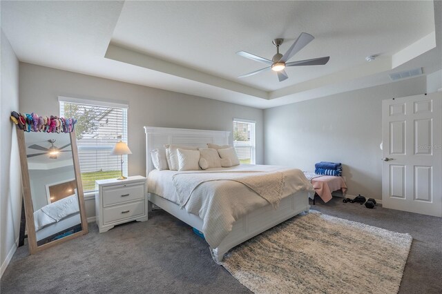 872 Sydney St, Davenport, FL 33837 - bedroom with carpet floors, a tray ceiling, and ceiling fan
