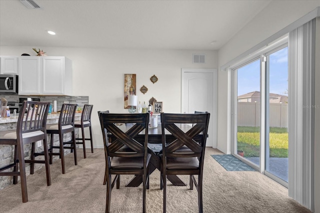 view of carpeted dining area