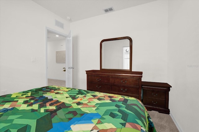 bedroom with light colored carpet