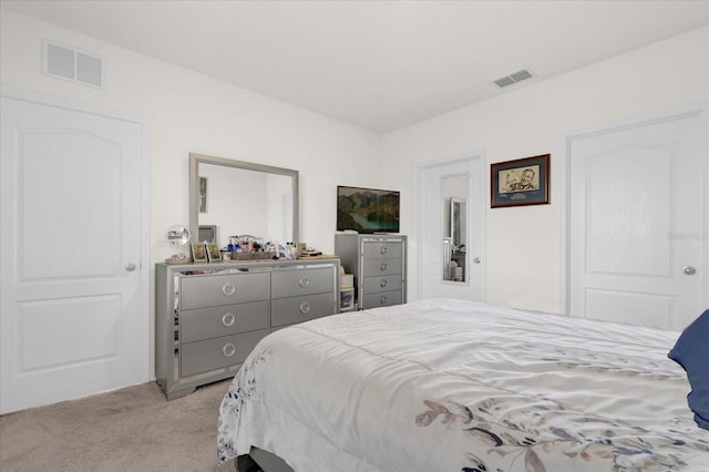 bedroom featuring light colored carpet