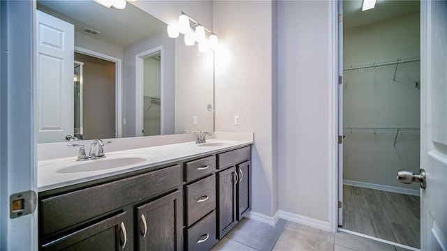 bathroom featuring vanity and tile patterned flooring