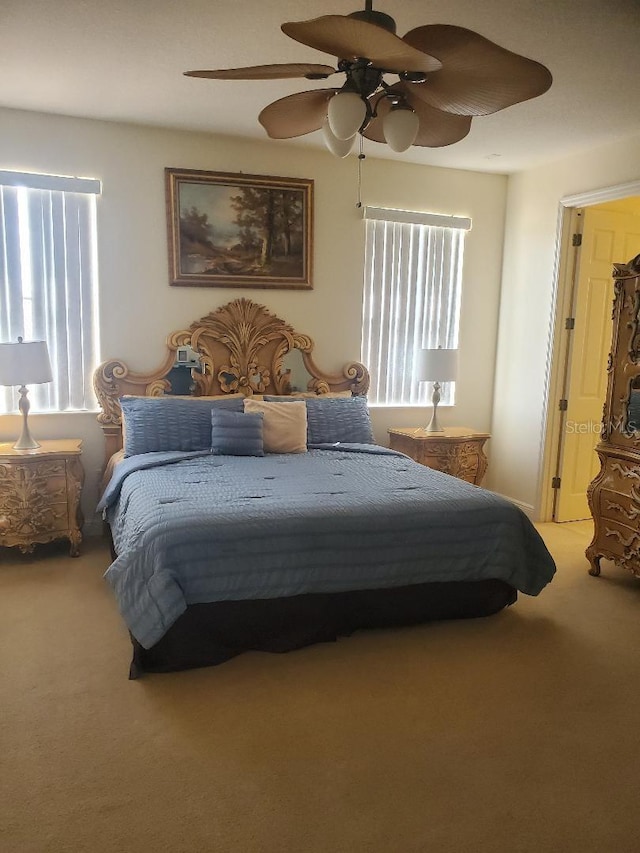 carpeted bedroom featuring ceiling fan