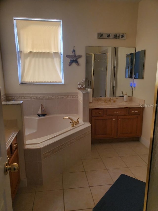 bathroom with vanity, separate shower and tub, and tile patterned flooring