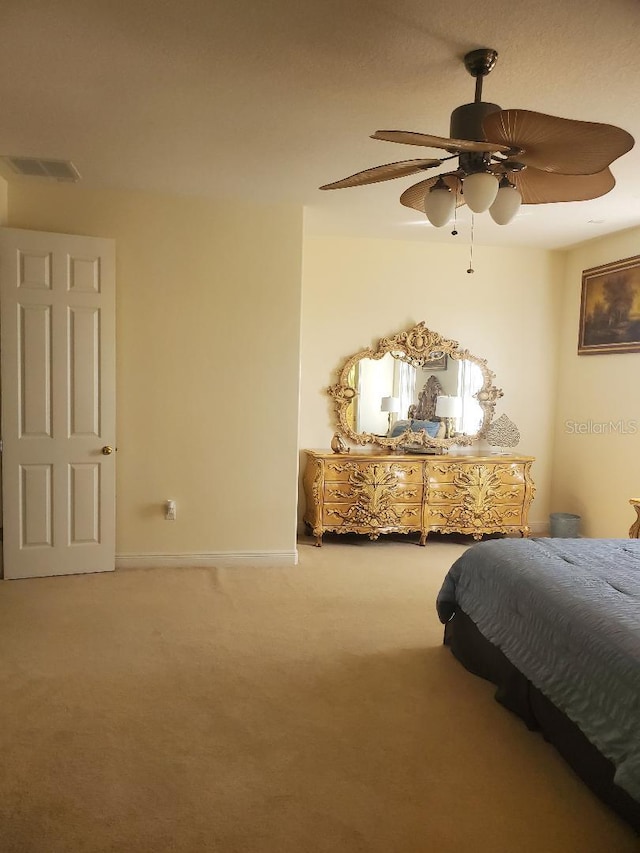 bedroom featuring ceiling fan and carpet flooring