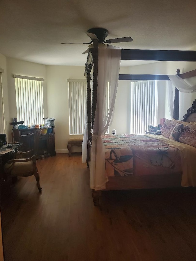 bedroom with wood-type flooring and ceiling fan