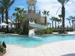 view of swimming pool with a water slide