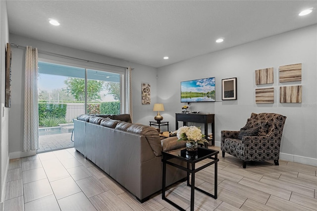 living room featuring a textured ceiling