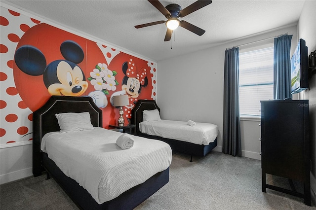 carpeted bedroom with a textured ceiling and ceiling fan