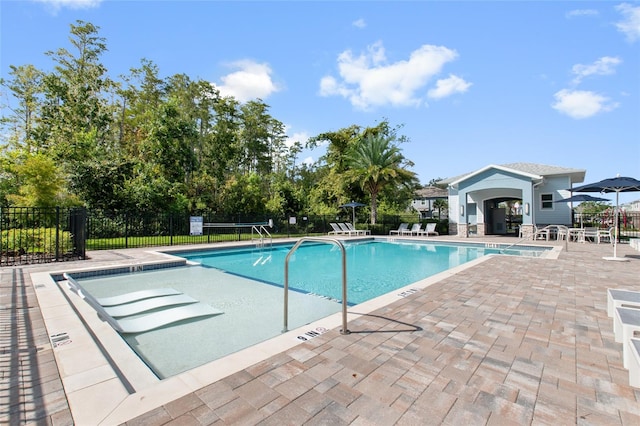 view of swimming pool featuring a patio